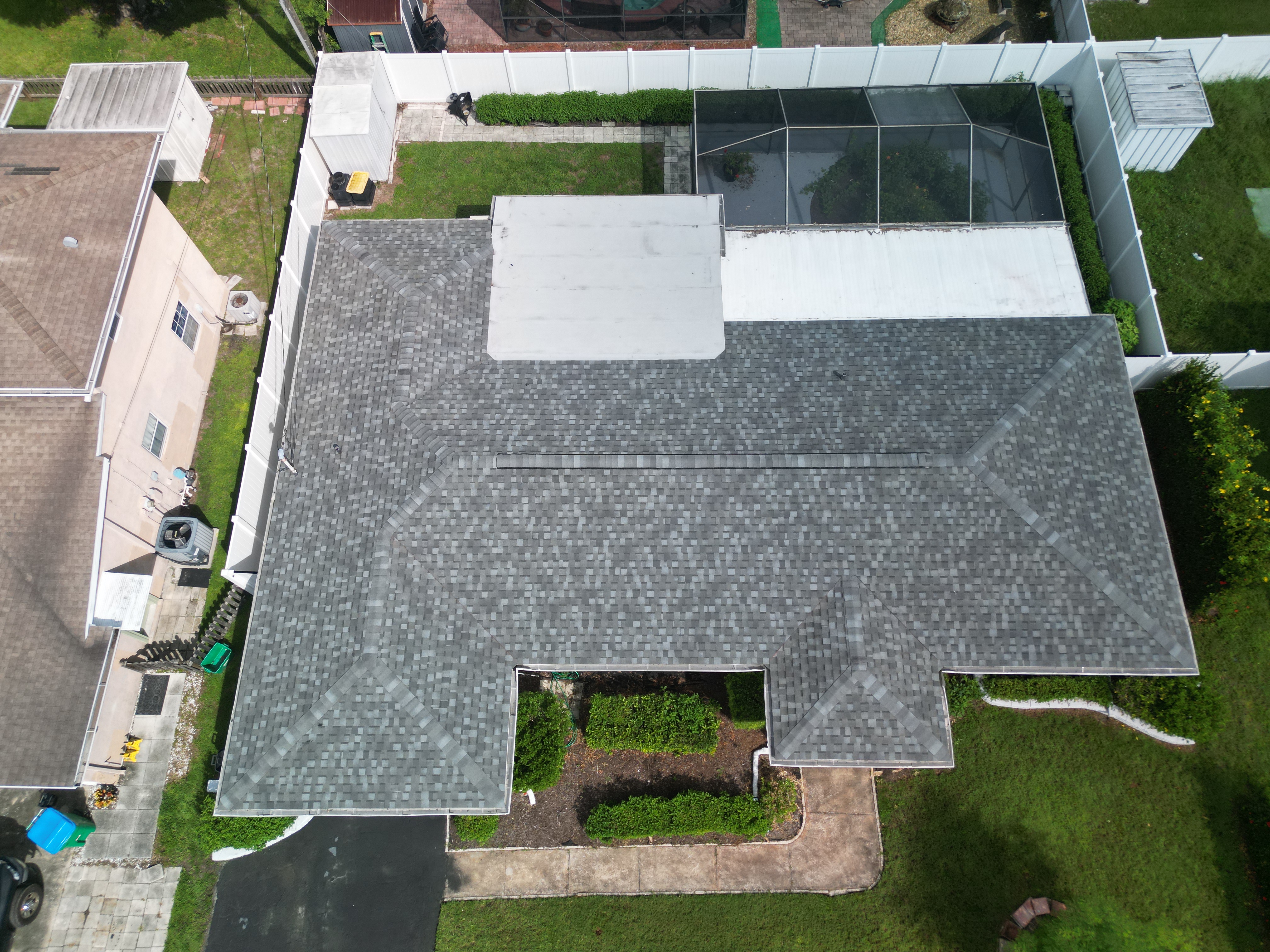 Clean new gray shingle roof, aerial view