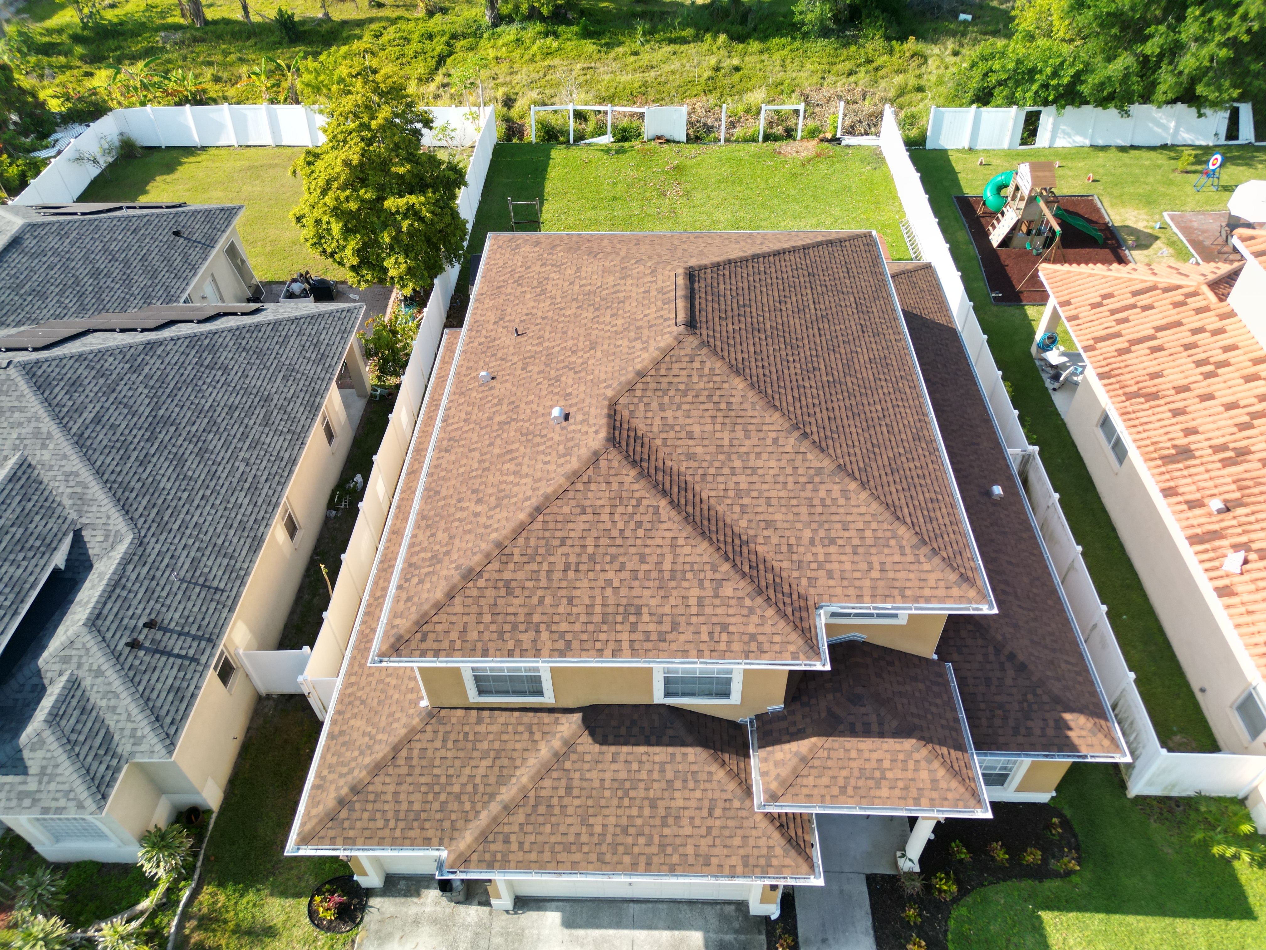 Newly installed architectural shingle roof, aerial view