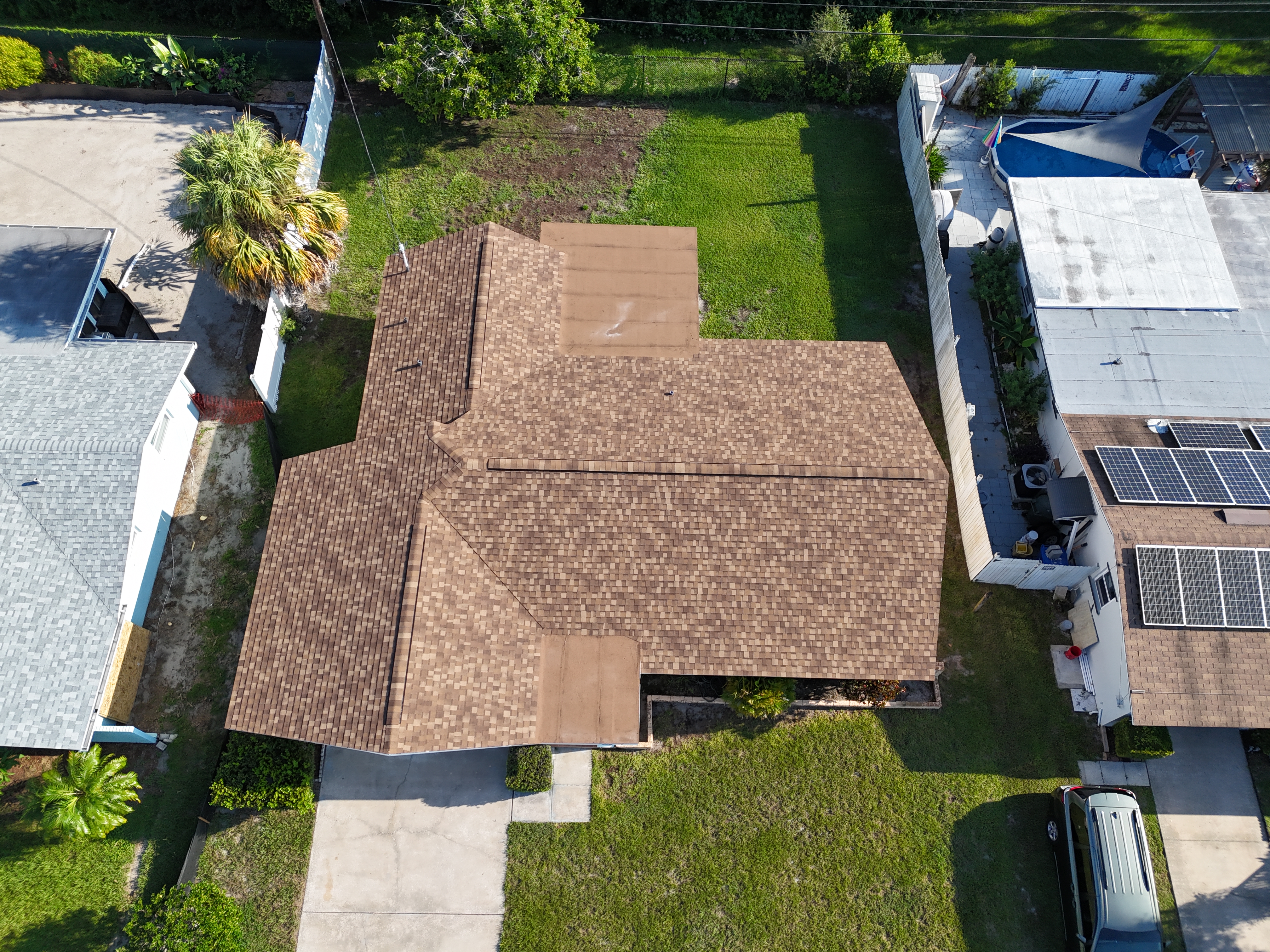 Roof mid-installation with underlayment down before shingles