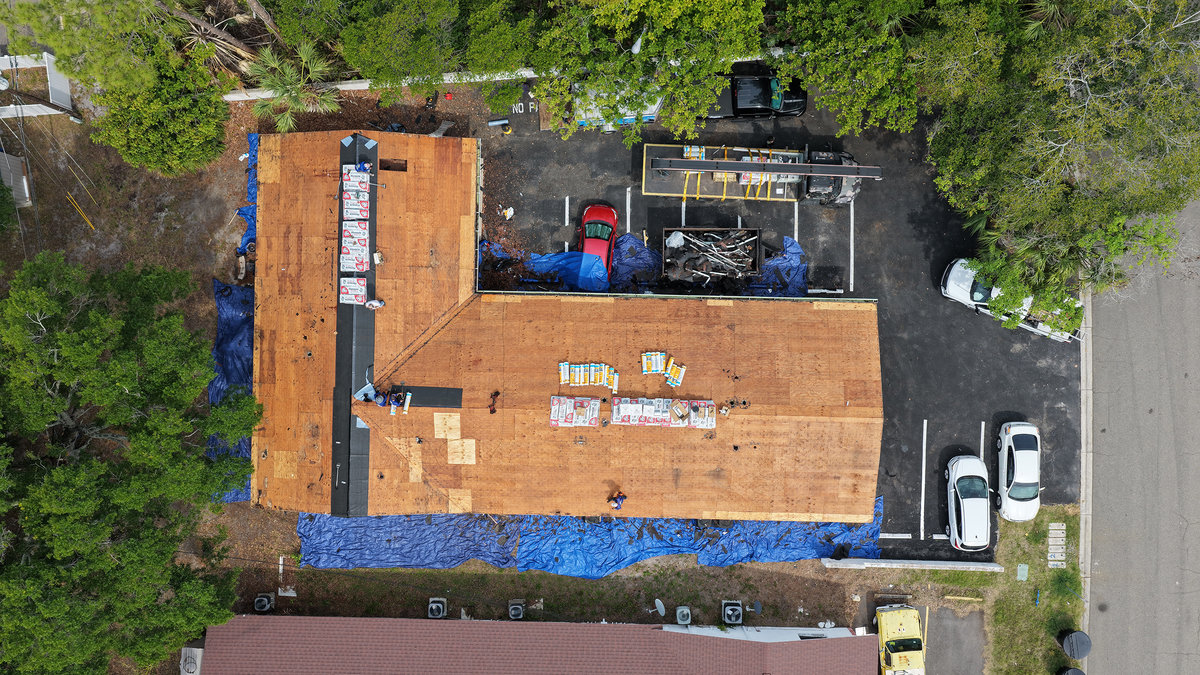 Spangler Roofing crew installing a new shingle roof in St. Petersburg