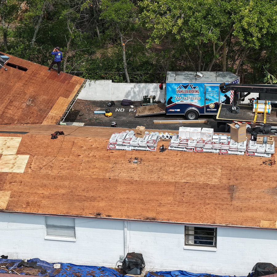 Soft, moisture-damaged roof decking exposed after shingle removal