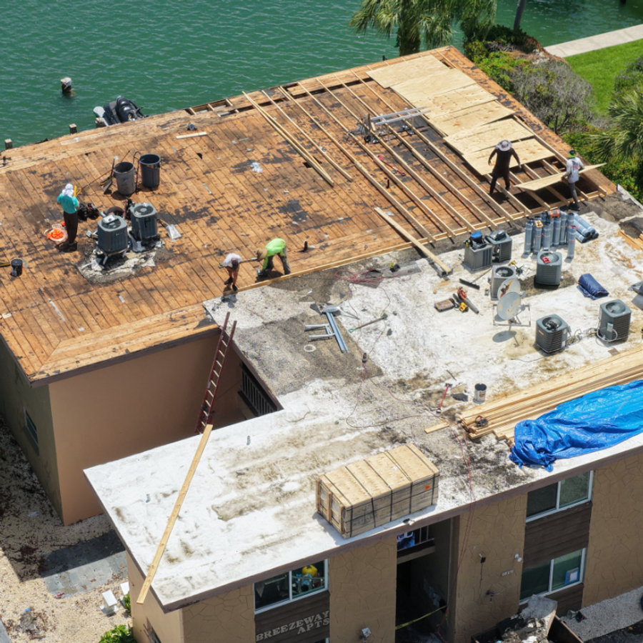 Flat roof lift kit installation in progress on a Treasure Island apartment building