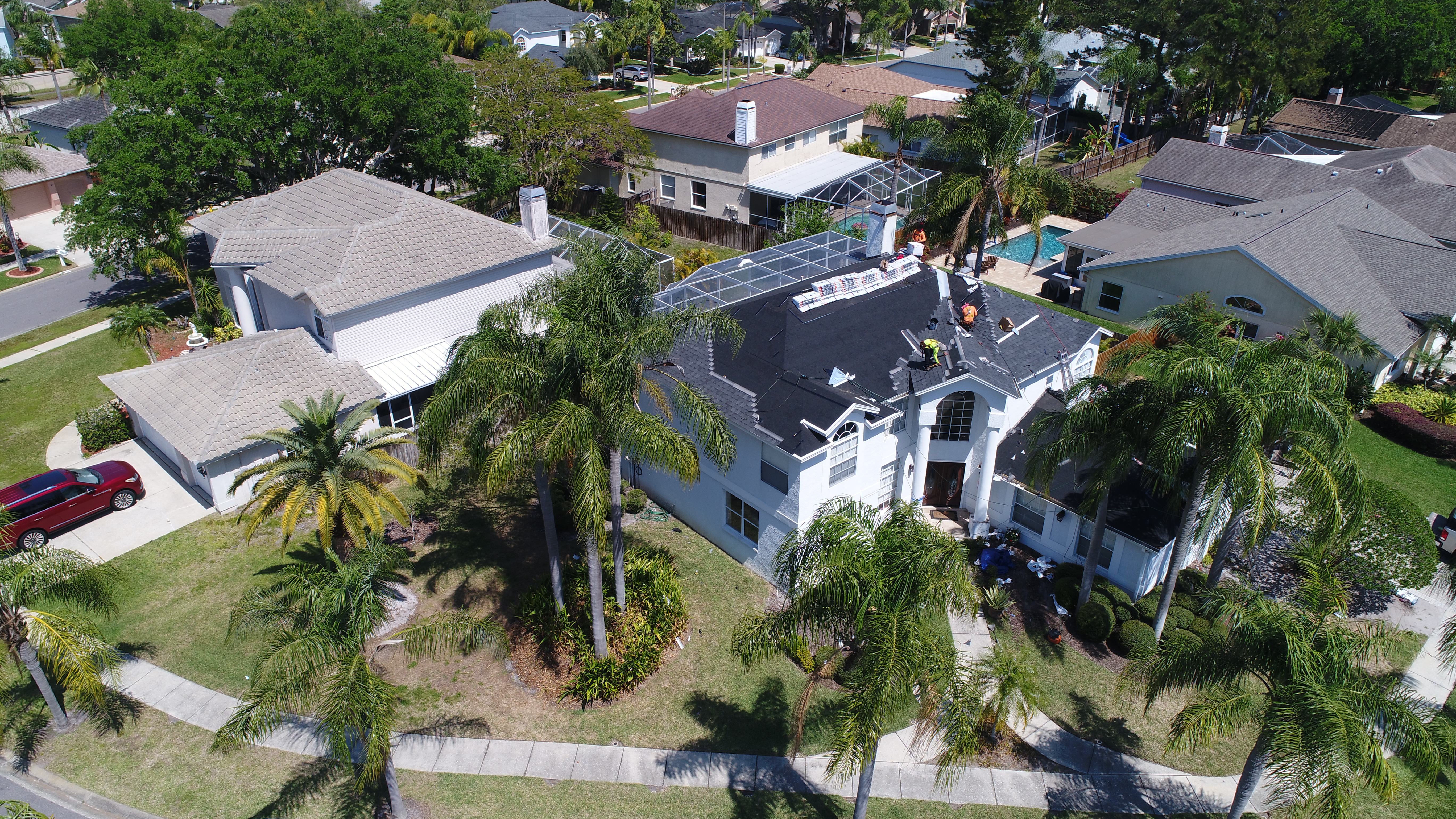 Reroof in progress on a large two-story home