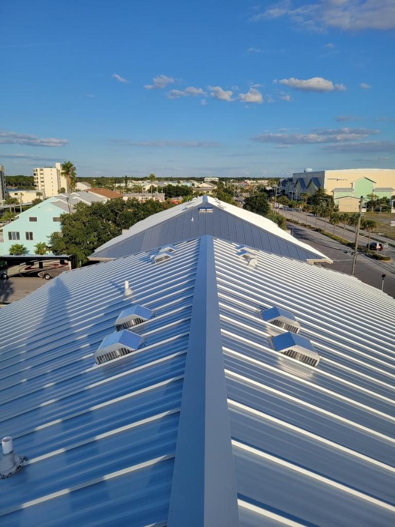 New standing seam metal roof with skylights installed by Spangler Roofing near the water