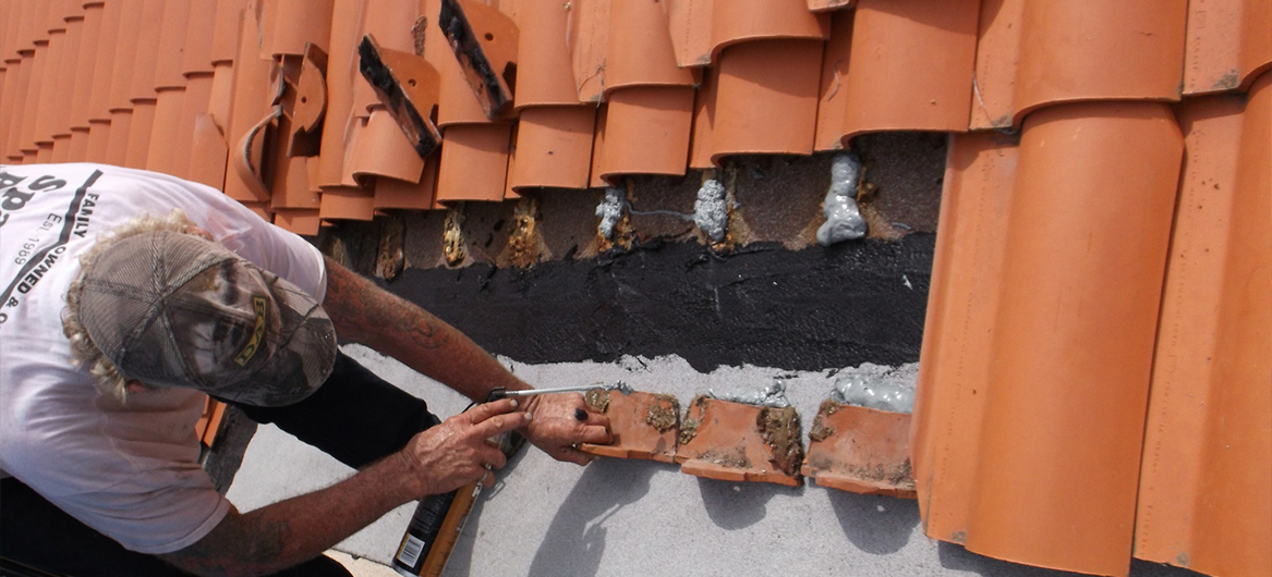 Spangler Roofing team member repairing tile on a St. Petersburg roof